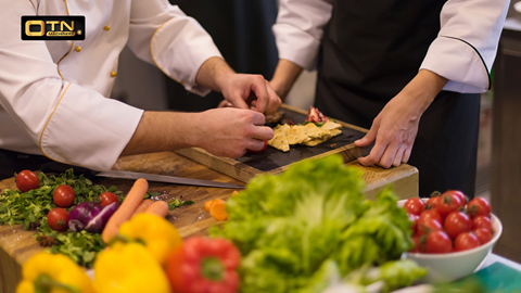 a group of people cooking food