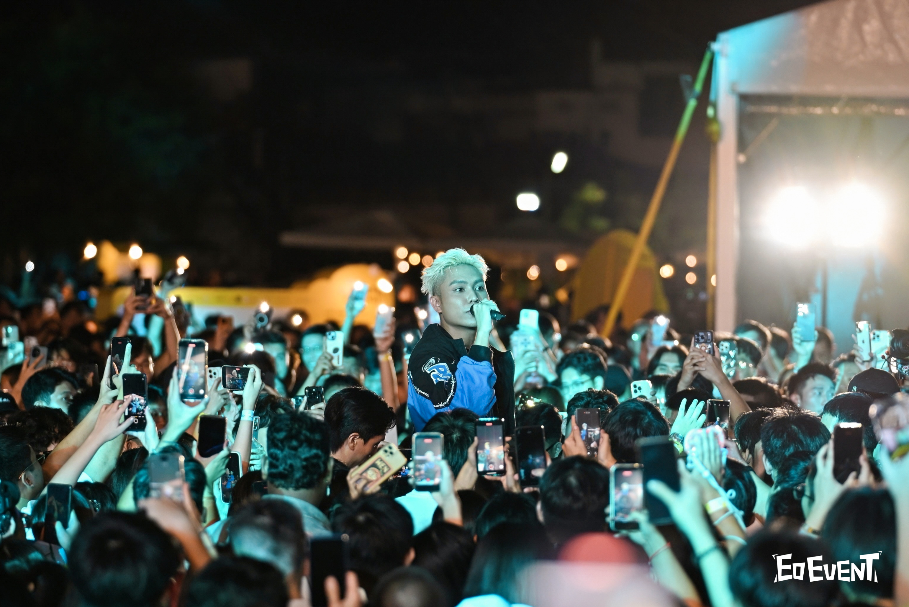 Rapper performing in the middle of the crowd at One Better Festival