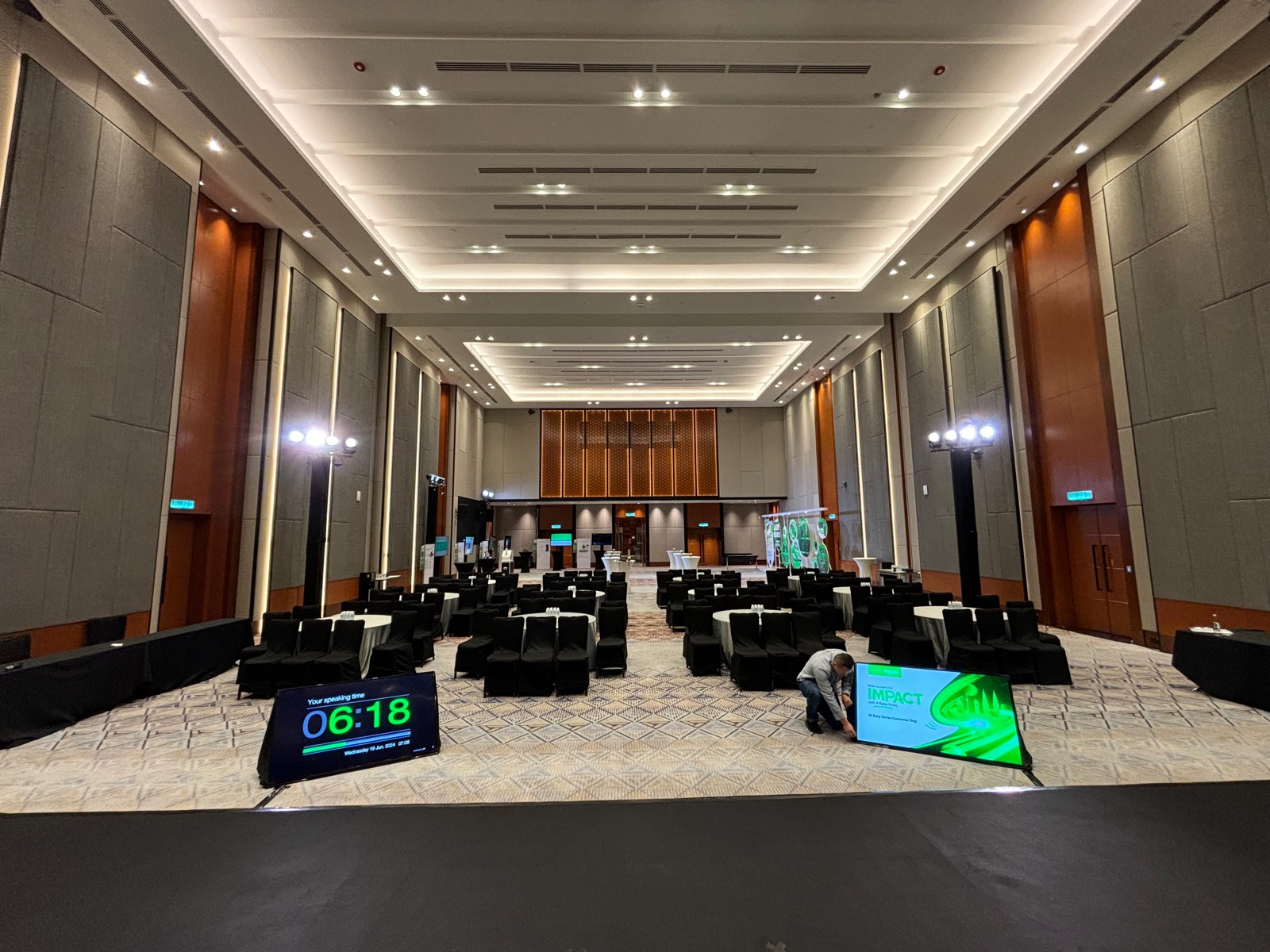 65 inch Comfort TV used as a stage confidence monitor for speaker scripts and countdown timers in Penang.