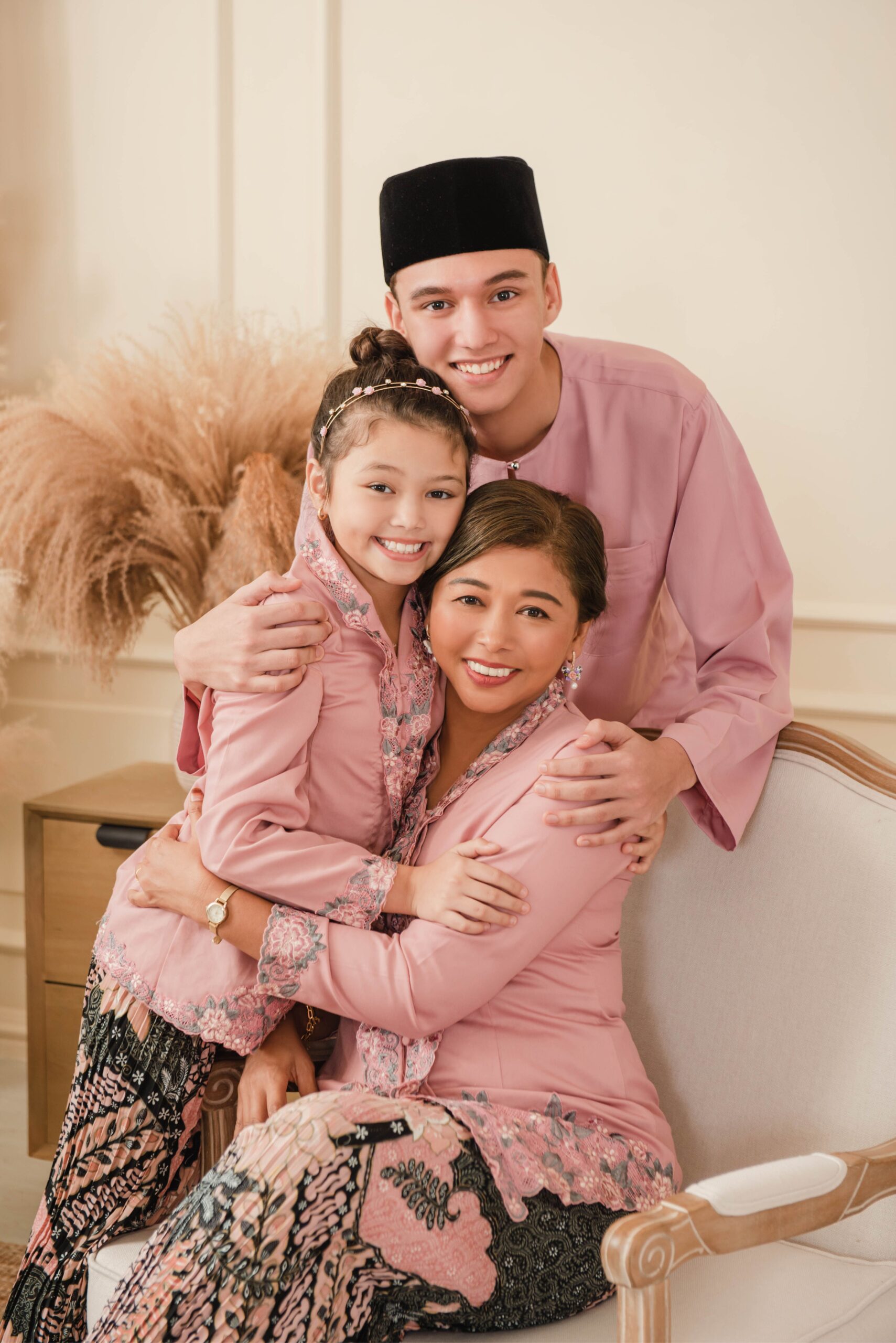 Family photography portrait of parents and children in coordinated traditional attire