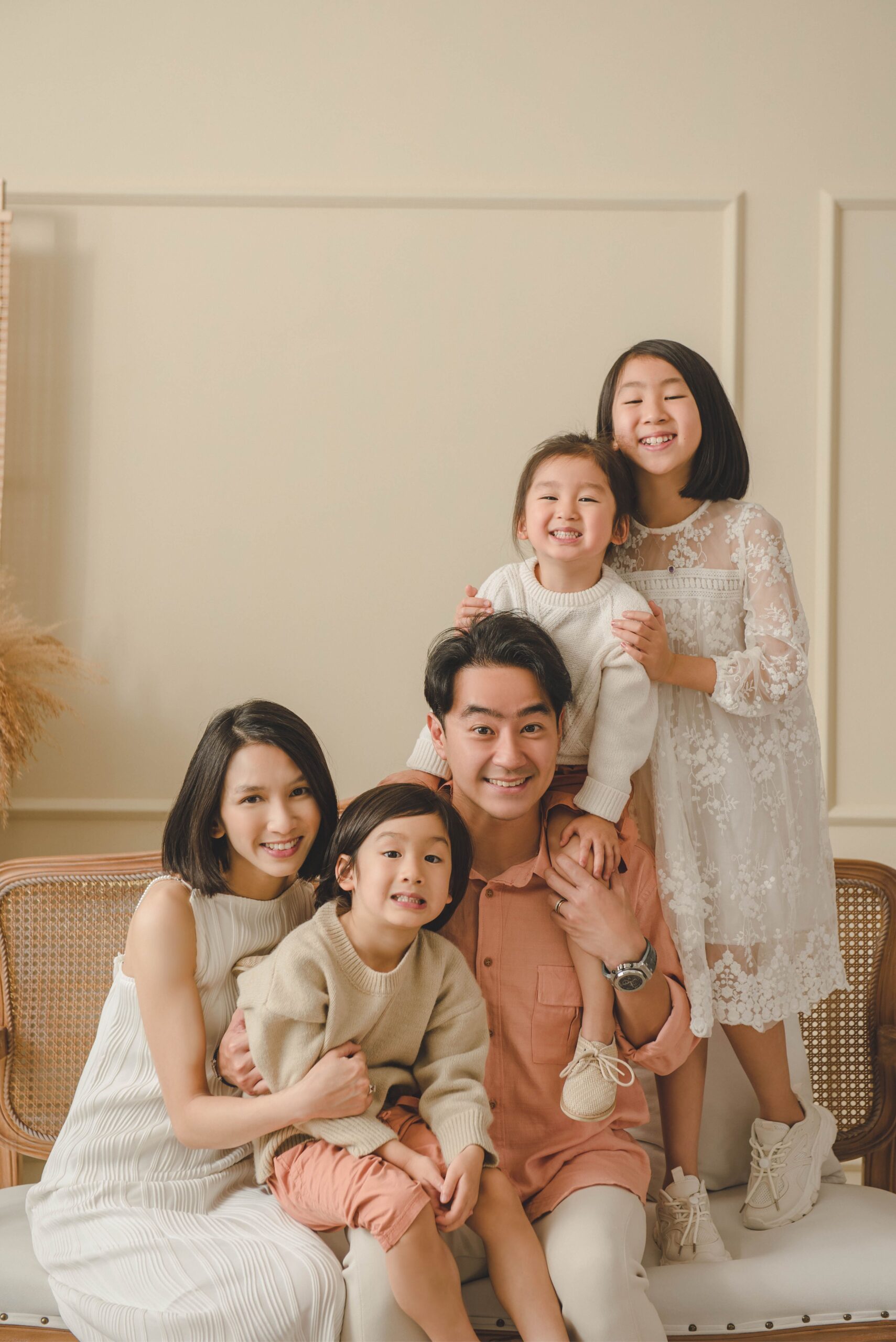 Relaxed family photography session capturing natural laughter and closeness