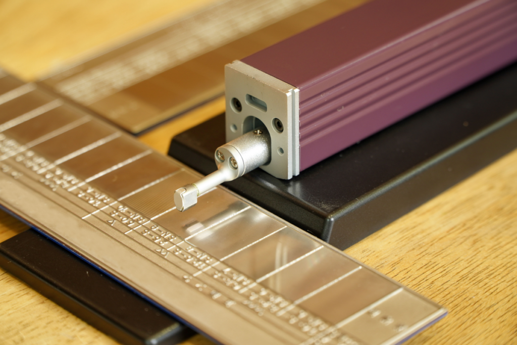 Surface roughness tester and reference specimen calibration